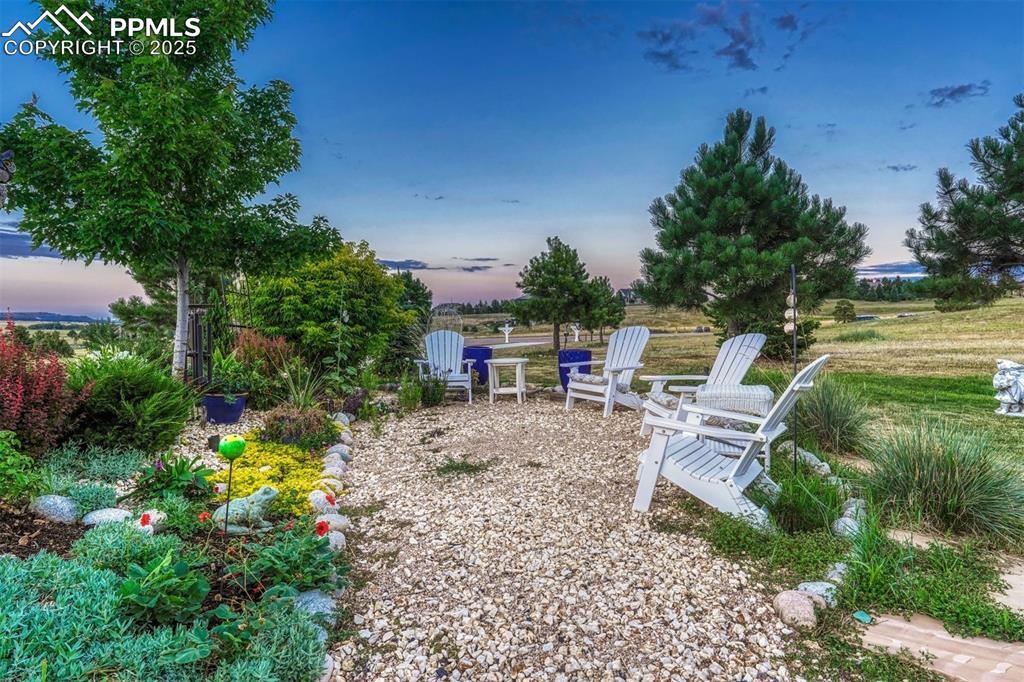 1935 Bashley Road Monument, CO 80132 - Photo 10 of 45 a view of a chair and tables in the garden