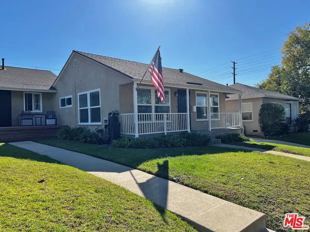 a view of a house with swimming pool and a yard