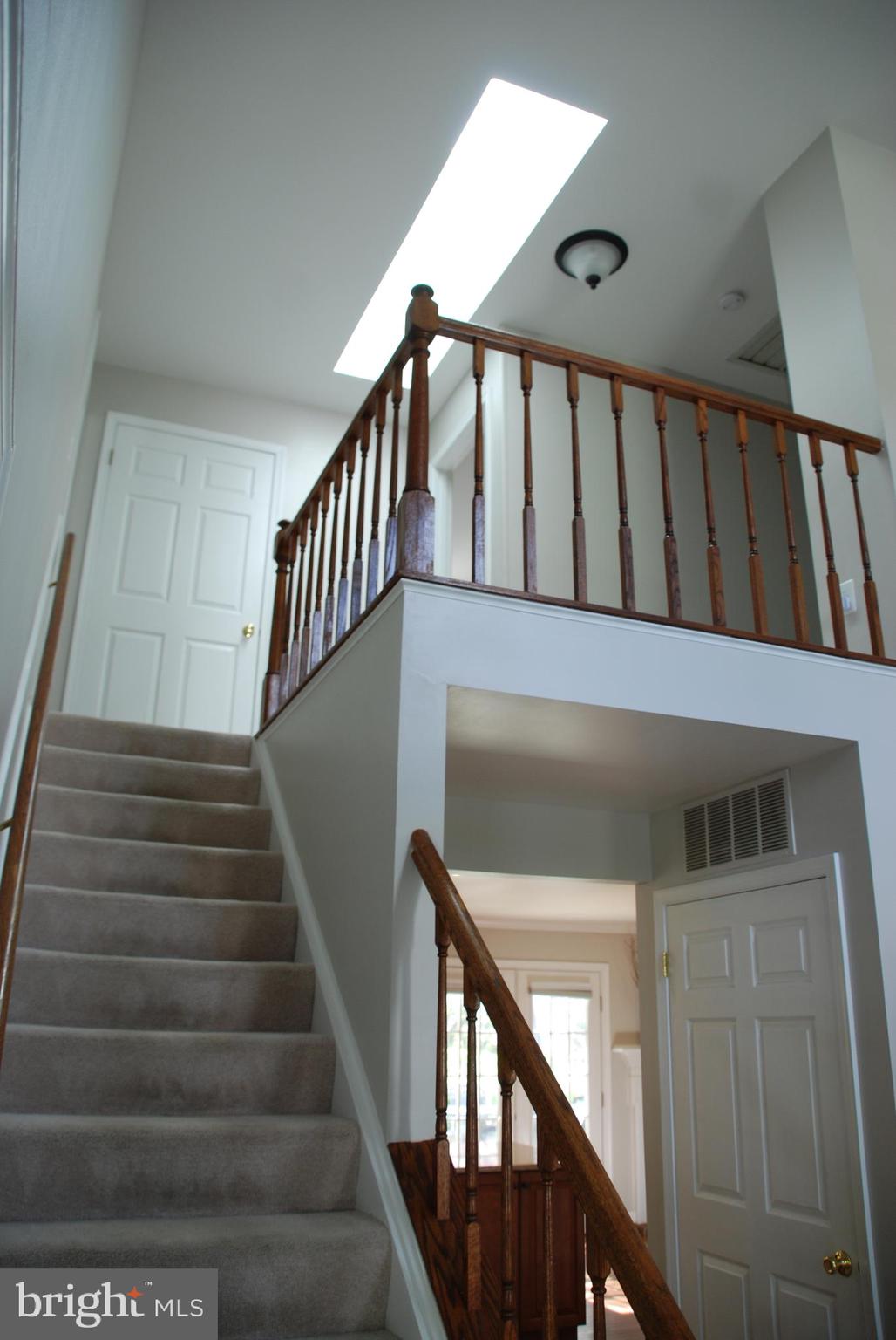 6108 Eagle Landing Road Burke, VA 22015 - Photo 21 of 52 Stairs 2 Upper Lvl from Foyer. Skylite in U1 Hall