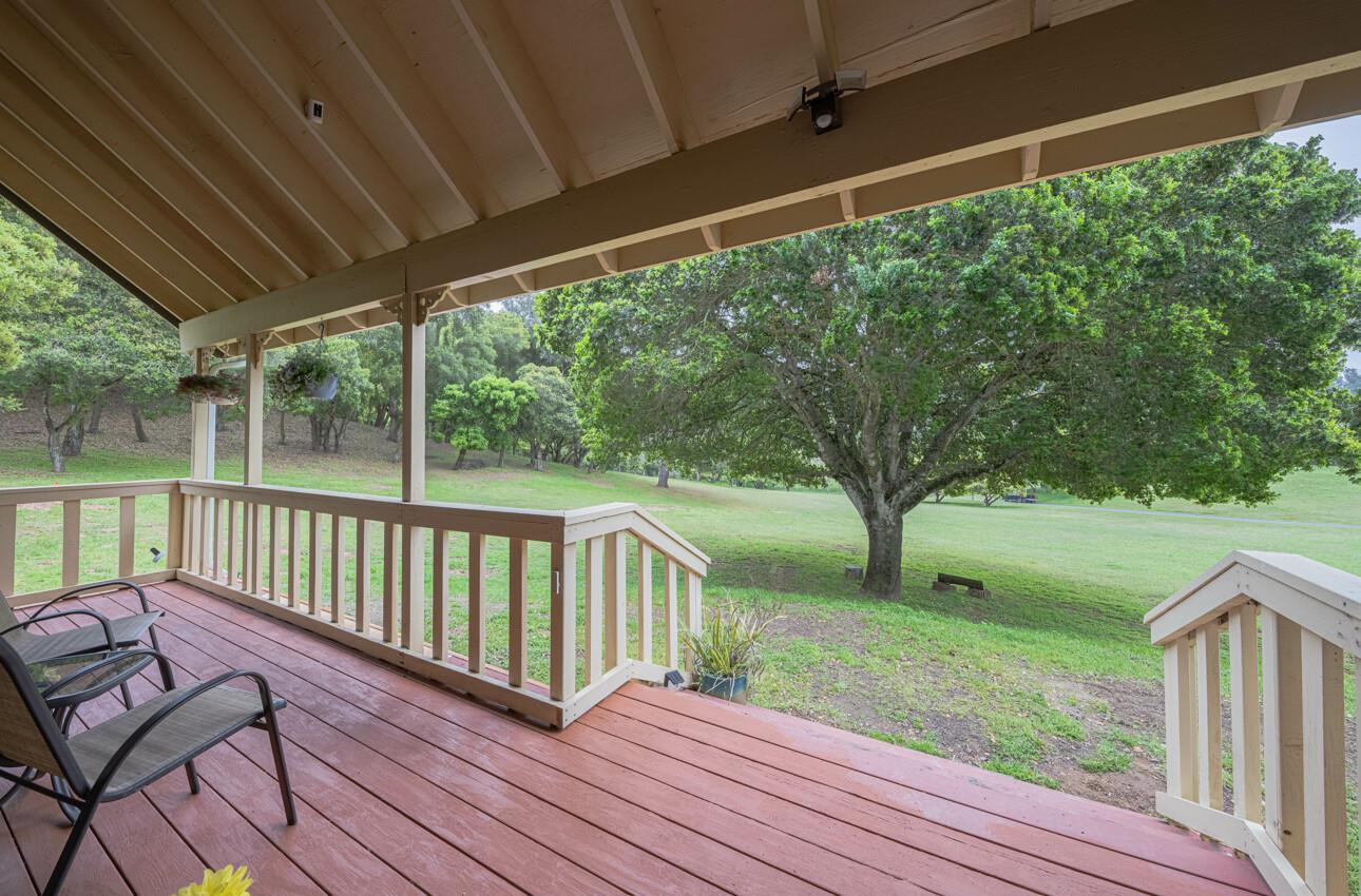 744 Seely Avenue Aromas, CA 95004 - Photo 17 of 55 a view of a wooden deck with a bench