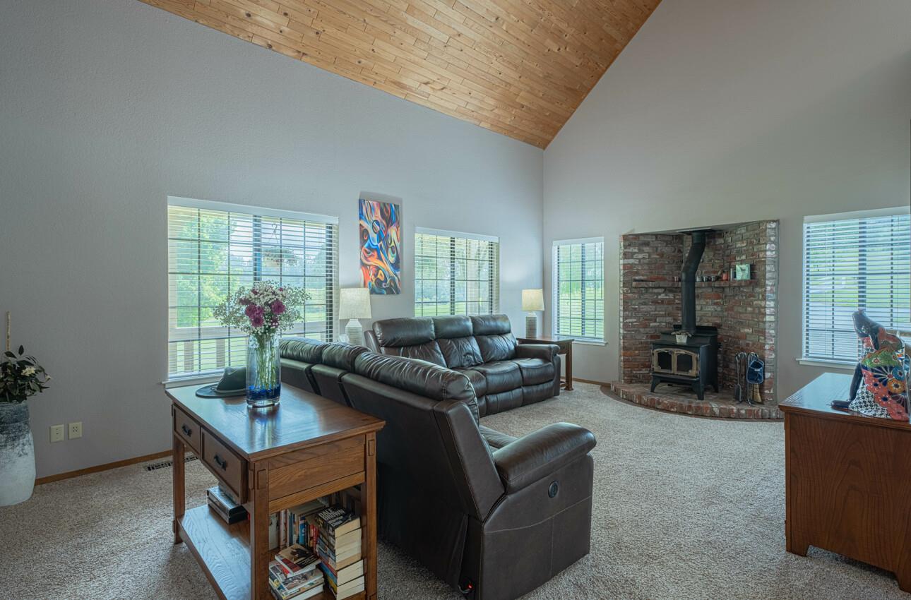 744 Seely Avenue Aromas, CA 95004 - Photo 20 of 55 a living room with furniture and a fireplace