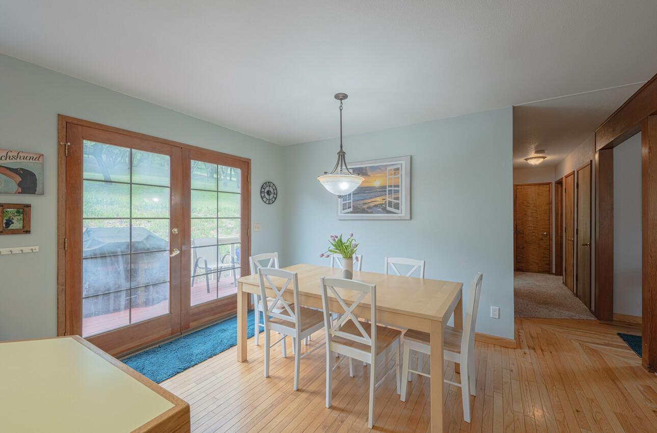 744 Seely Avenue Aromas, CA 95004 - Photo 23 of 55 a view of a dining room with furniture and wooden floor