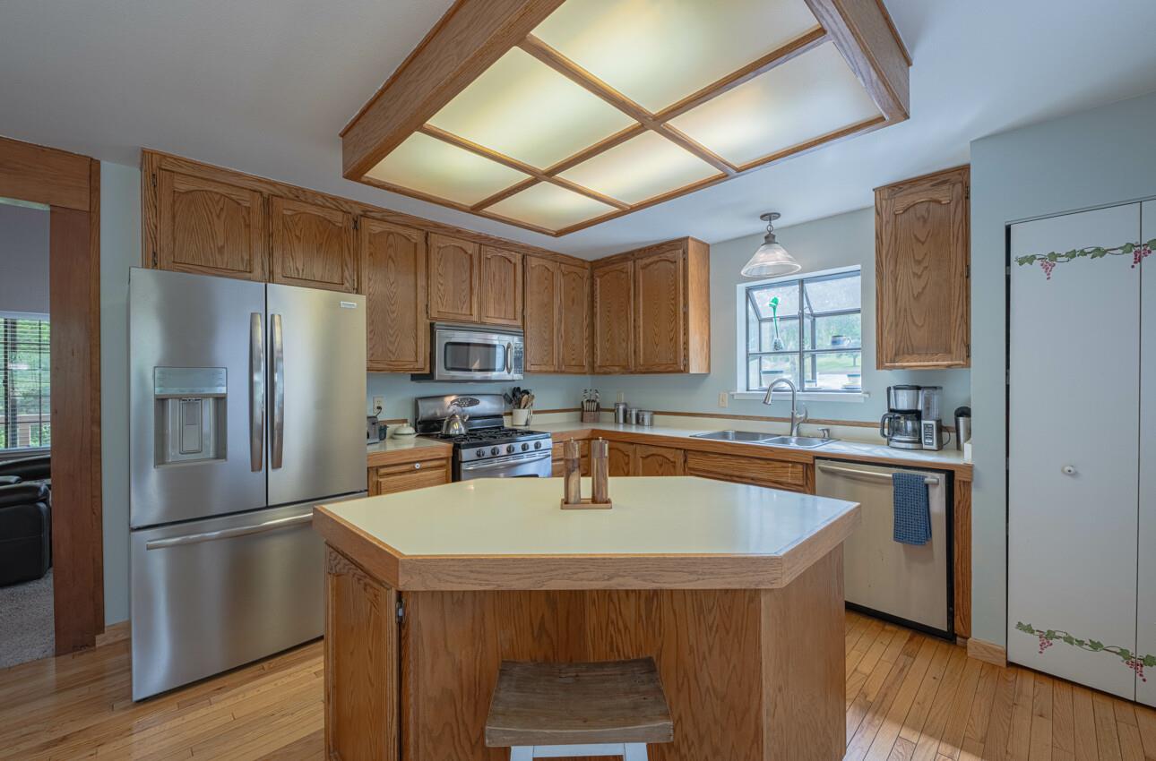 744 Seely Avenue Aromas, CA 95004 - Photo 26 of 55 a kitchen with granite countertop a sink appliances cabinets and counter space