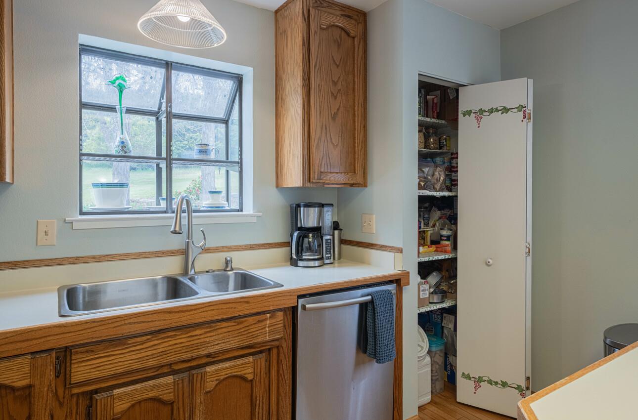 744 Seely Avenue Aromas, CA 95004 - Photo 28 of 55 a kitchen with stainless steel appliances granite countertop a sink stove and cabinets
