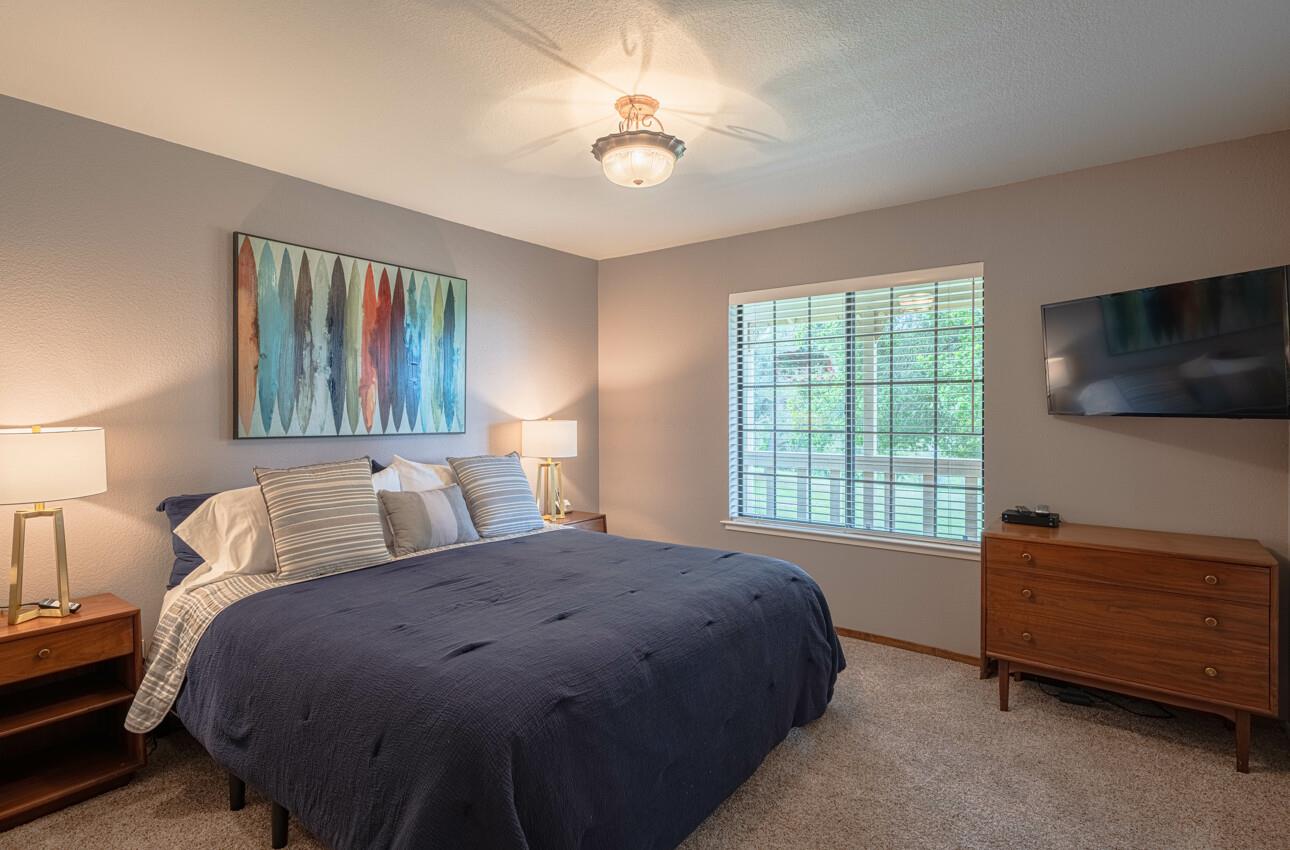 744 Seely Avenue Aromas, CA 95004 - Photo 30 of 55 a bedroom with a bed and a tv