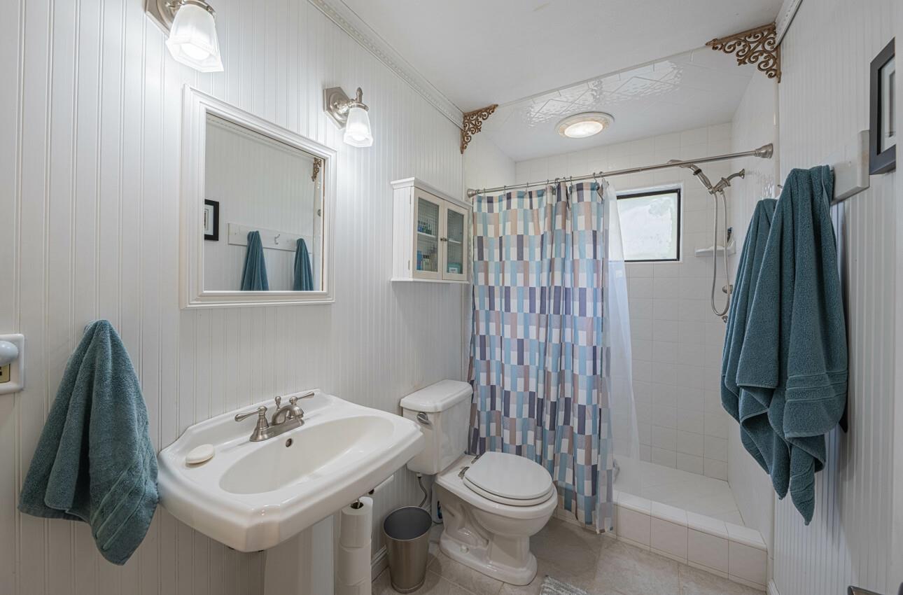 744 Seely Avenue Aromas, CA 95004 - Photo 33 of 55 a bathroom with a sink toilet and shower
