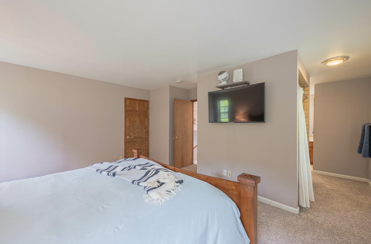 744 Seely Avenue Aromas, CA 95004 - Photo 41 of 55 a bedroom with a bed and a flat screen tv
