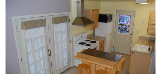 744 Seely Avenue Aromas, CA 95004 - Photo 51 of 55 a room with a refrigerator and a stove