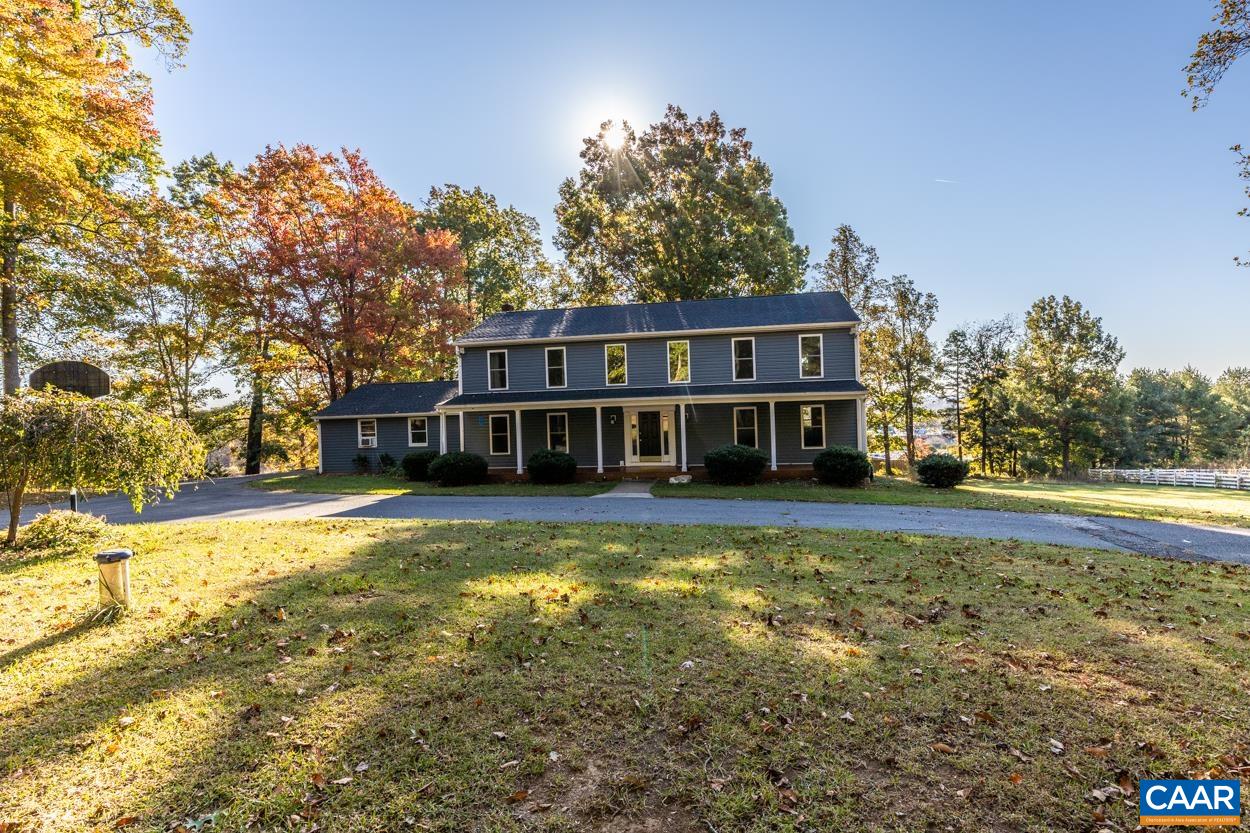 435 Courthouse Mountain Road Madison, VA 22727 - Photo 1 of 69 a view of a house with pool and trees in the background