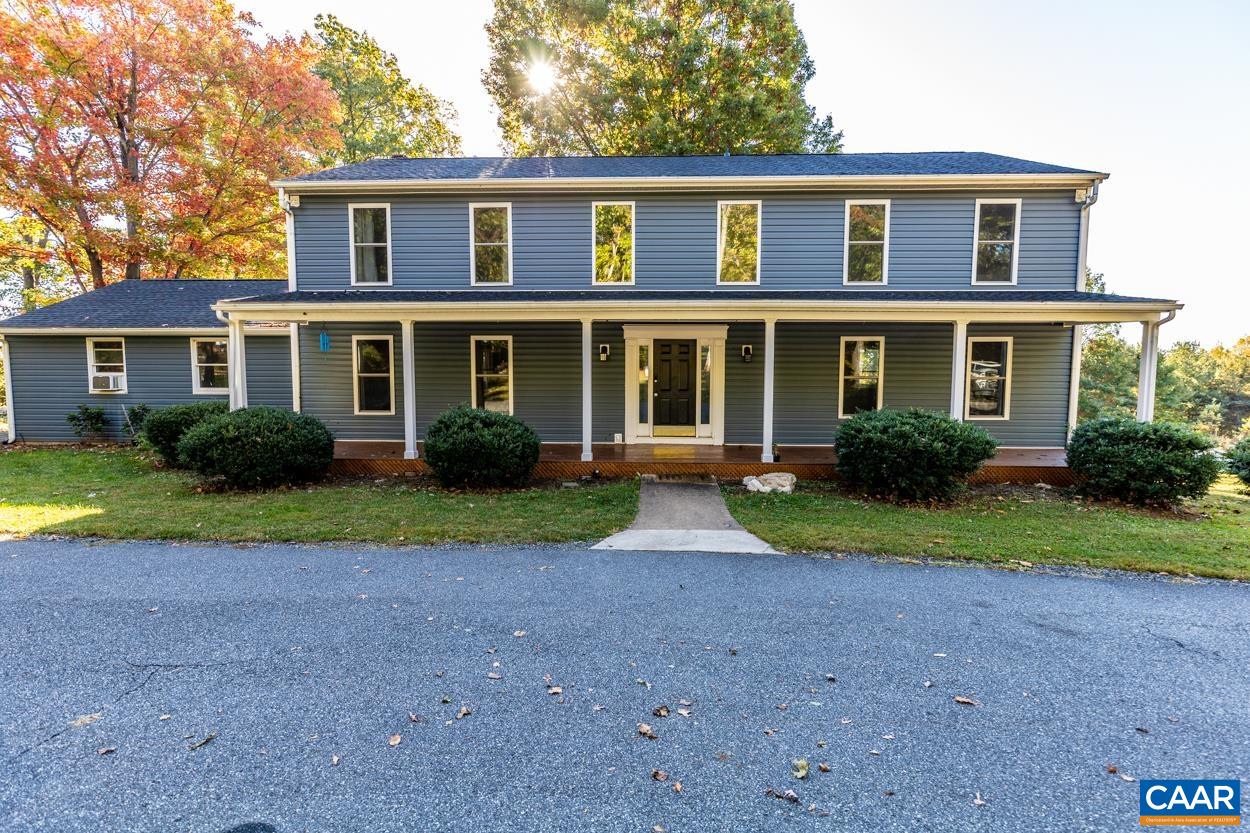 435 Courthouse Mountain Road Madison, VA 22727 - Photo 2 of 69 a front view of a house with garden