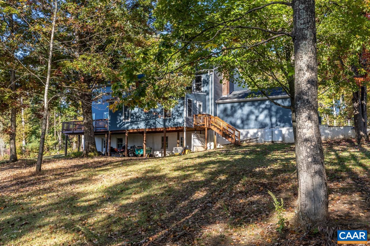 435 Courthouse Mountain Road Madison, VA 22727 - Photo 23 of 69 a view of a house with large tree and wooden fence