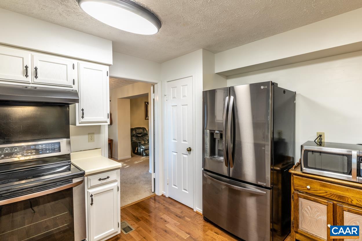435 Courthouse Mountain Road Madison, VA 22727 - Photo 24 of 69 a kitchen with stainless steel appliances a refrigerator stove and microwave