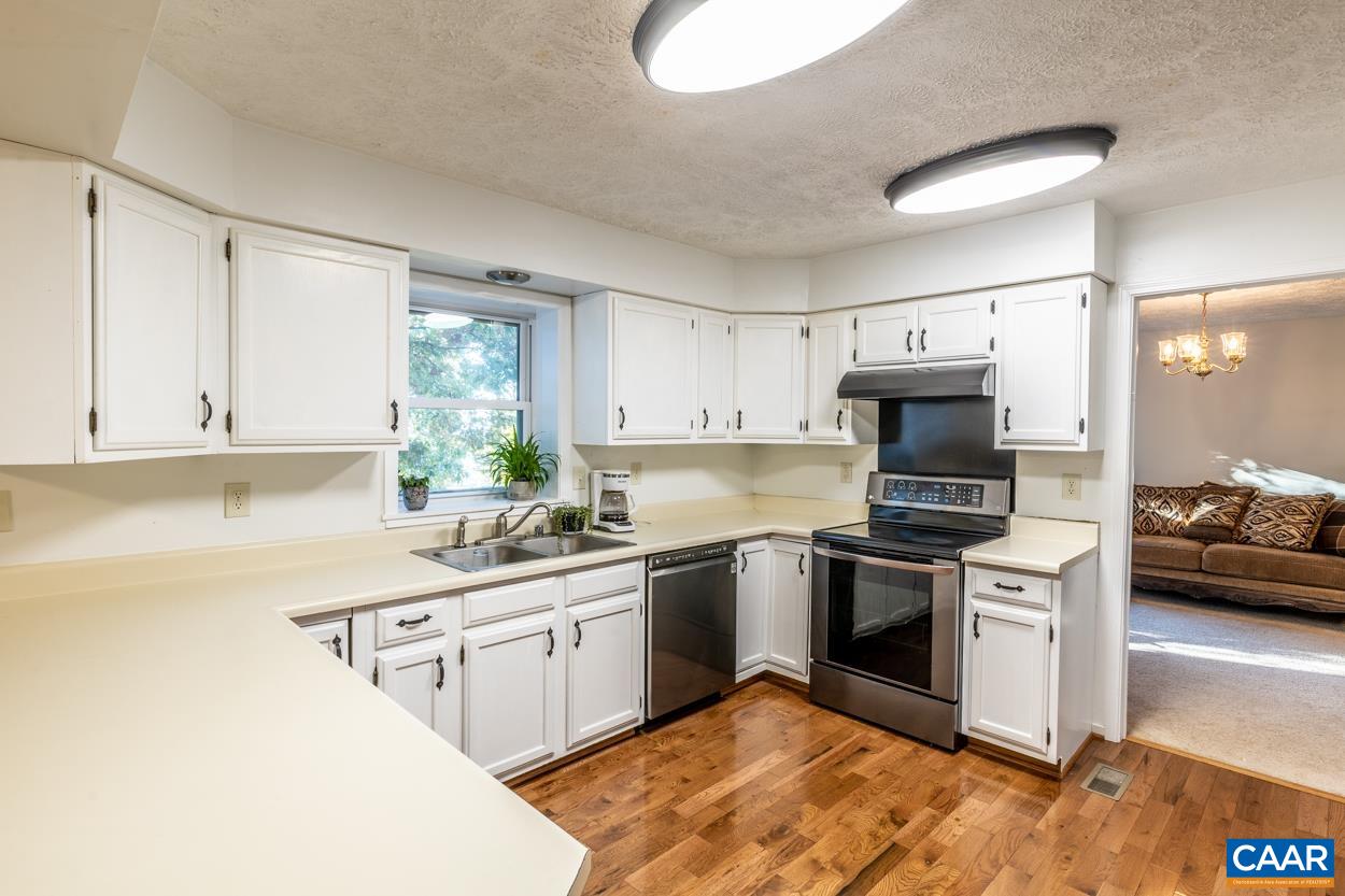 435 Courthouse Mountain Road Madison, VA 22727 - Photo 25 of 69 a kitchen with a sink white cabinets and stainless steel appliances