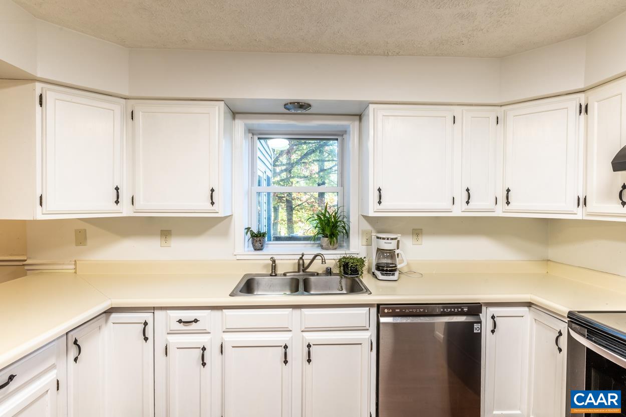 435 Courthouse Mountain Road Madison, VA 22727 - Photo 26 of 69 a kitchen with a sink cabinets window and appliances