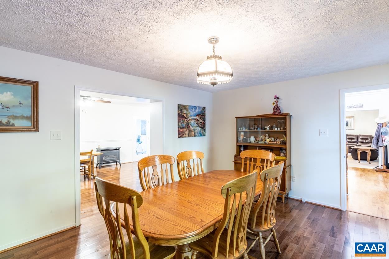 435 Courthouse Mountain Road Madison, VA 22727 - Photo 31 of 69 a view of a dining room with furniture and wooden floor