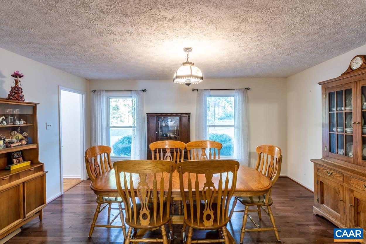 435 Courthouse Mountain Road Madison, VA 22727 - Photo 32 of 69 a view of a dining room with furniture window and wooden floor