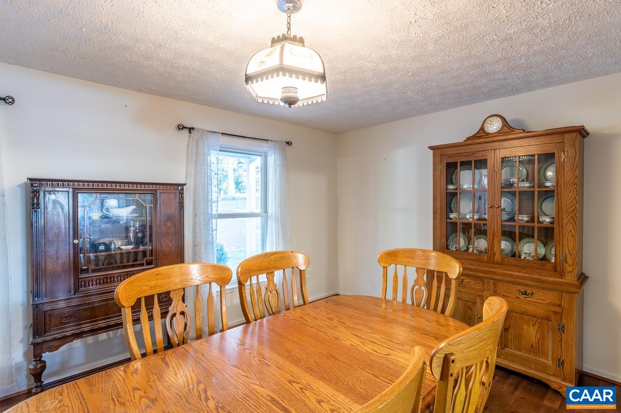 435 Courthouse Mountain Road Madison, VA 22727 - Photo 33 of 69 a view of a dining room with furniture and window