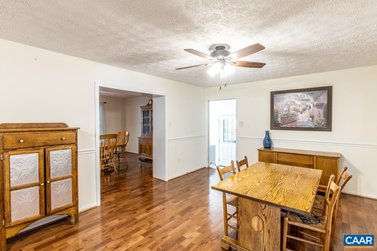 435 Courthouse Mountain Road Madison, VA 22727 - Photo 34 of 69 a living room with furniture and wooden floor