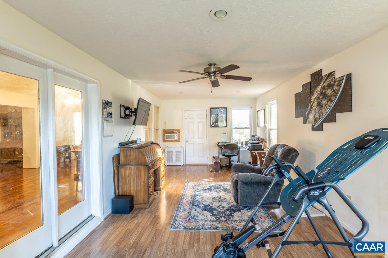 435 Courthouse Mountain Road Madison, VA 22727 - Photo 38 of 69 a view of a livingroom with furniture wooden floor and windows