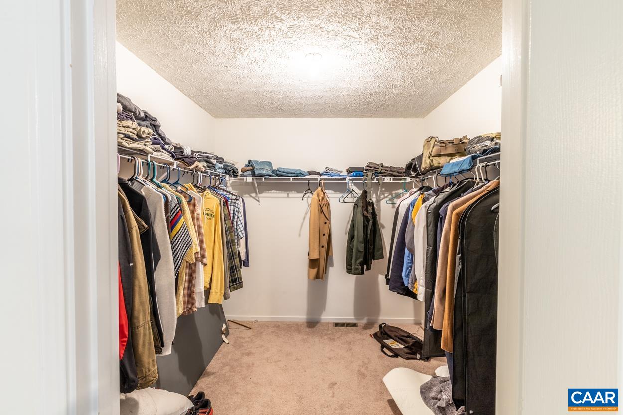435 Courthouse Mountain Road Madison, VA 22727 - Photo 49 of 69 a view of walk in closet with clothes and shoes