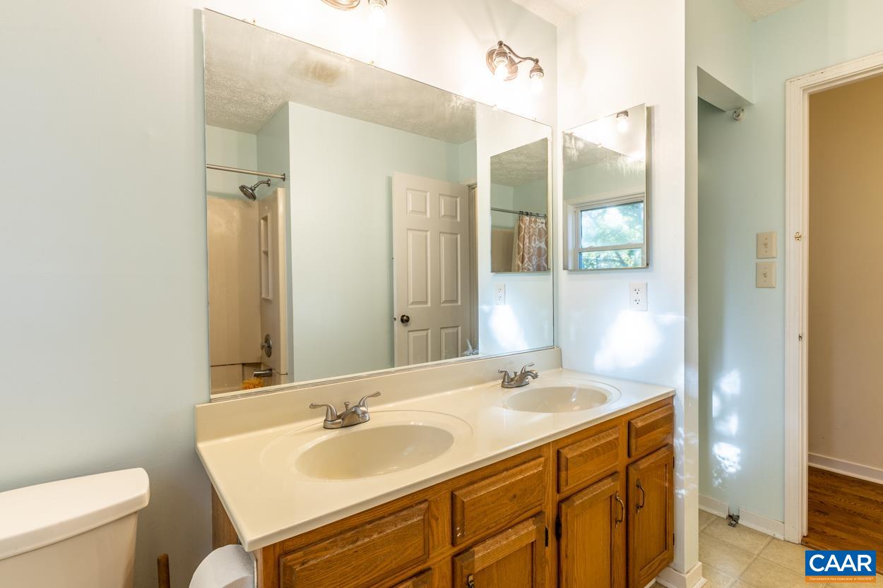 435 Courthouse Mountain Road Madison, VA 22727 - Photo 57 of 69 a bathroom with a sink and a mirror