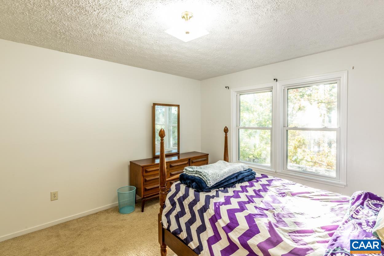 435 Courthouse Mountain Road Madison, VA 22727 - Photo 60 of 69 a bedroom with a bed and a window