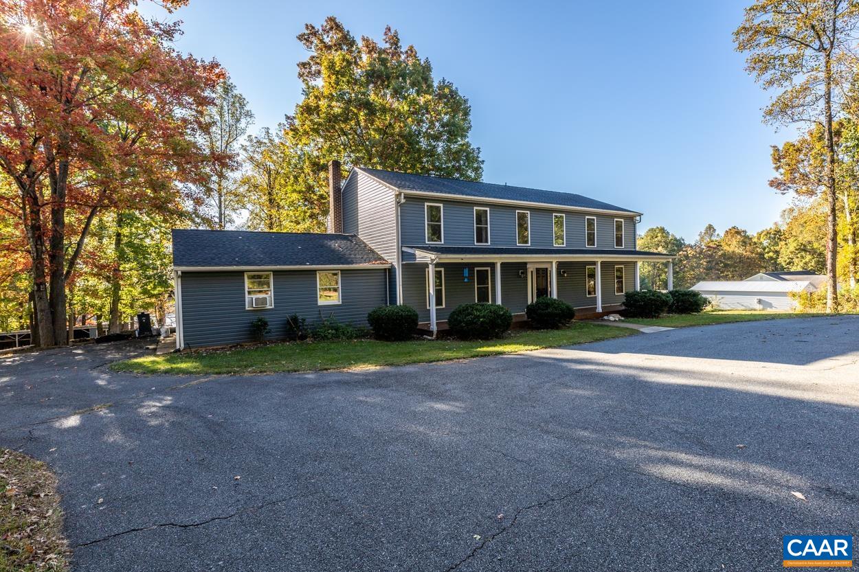 435 Courthouse Mountain Road Madison, VA 22727 - Photo 6 of 69 a front view of a house with a yard and trees