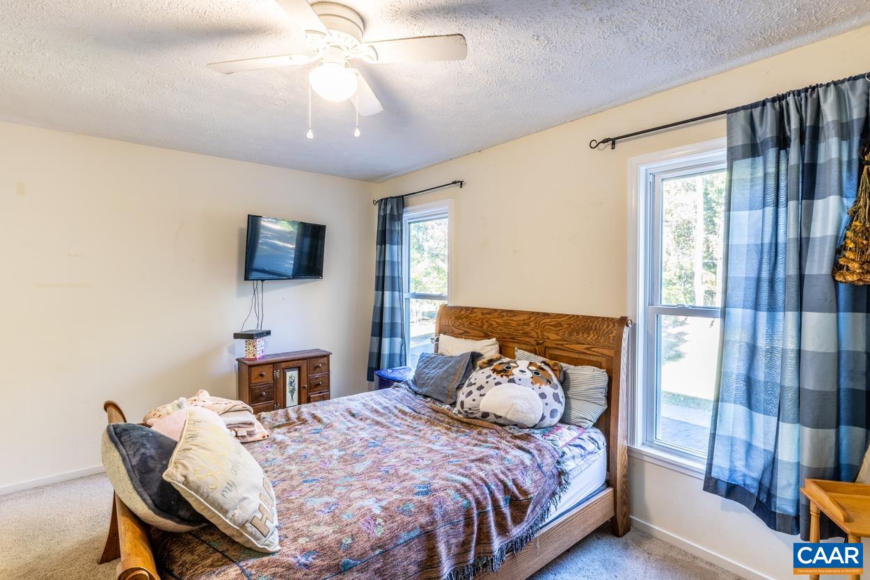 435 Courthouse Mountain Road Madison, VA 22727 - Photo 62 of 69 a bedroom with a bed and a table