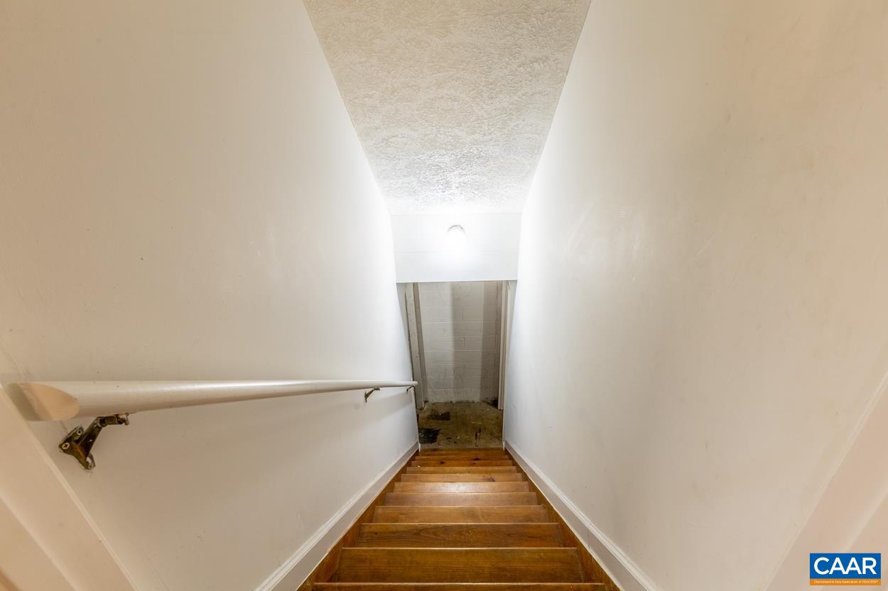 435 Courthouse Mountain Road Madison, VA 22727 - Photo 64 of 69 a view of a hallway with wooden floor and a white door