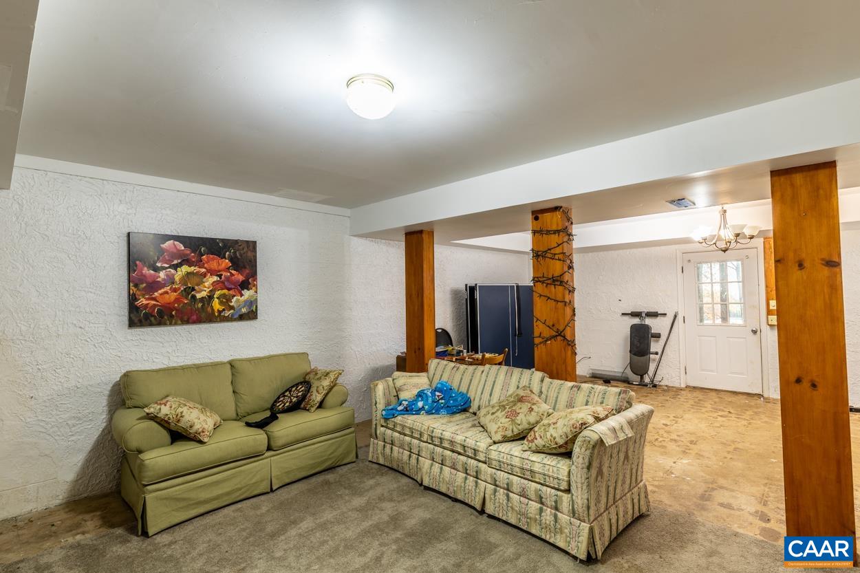 435 Courthouse Mountain Road Madison, VA 22727 - Photo 65 of 69 a living room with furniture and a couch