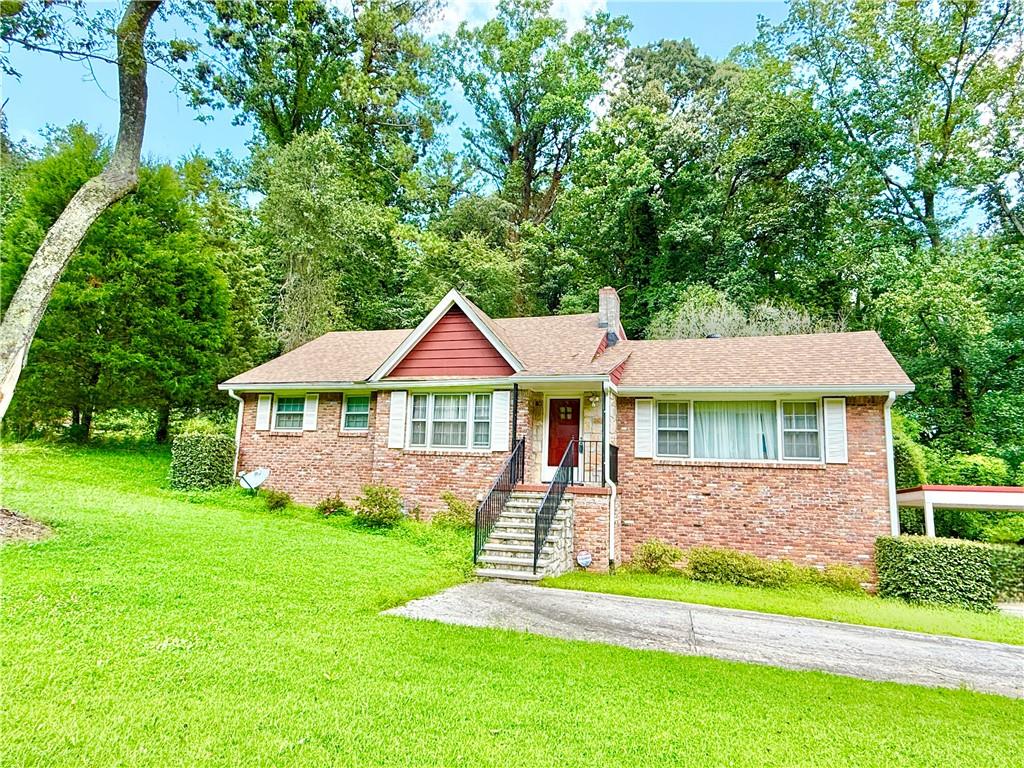2177 Connally Drive Atlanta, GA 30344 - Photo 1 of 1 a front view of a house with a yard