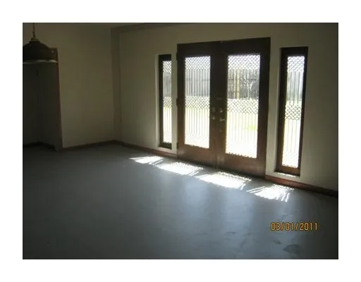 a view of an empty room and window
