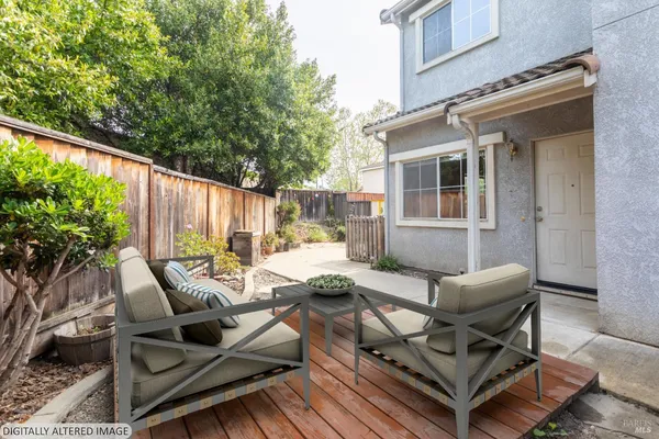 a view of a patio with couches chairs and potted plants