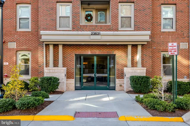 a front view of a house with swimming pool and glass windows