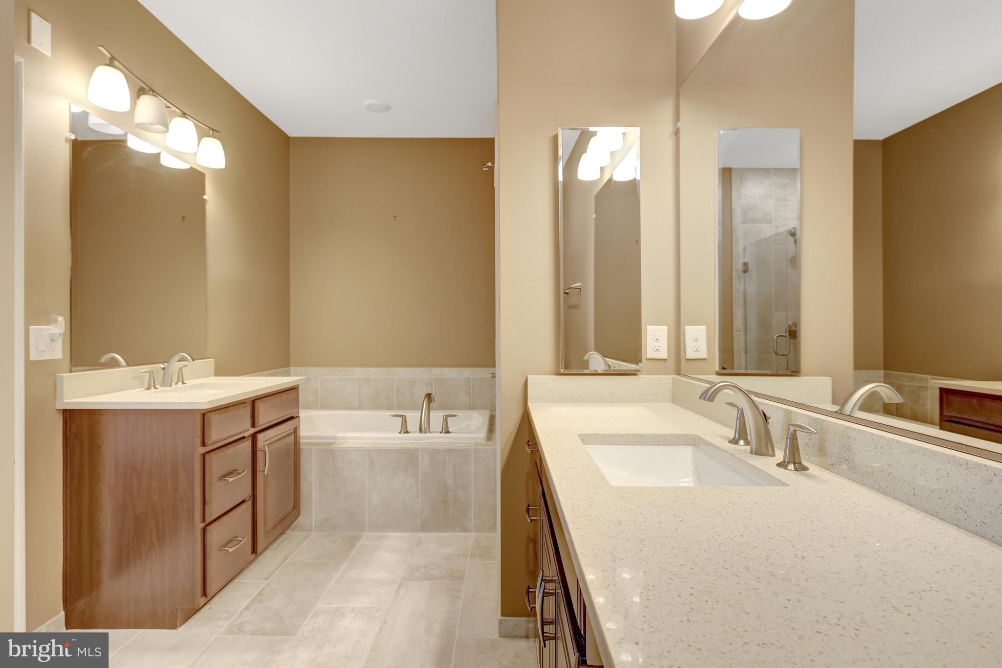 23631 Havelock Walk Terrace, Unit 404 Ashburn, VA 20148 - Photo 28 of 51 Primary Bath with His & Her Vanities