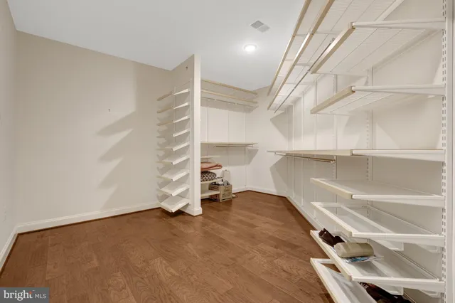 a view of an empty room with a staircase