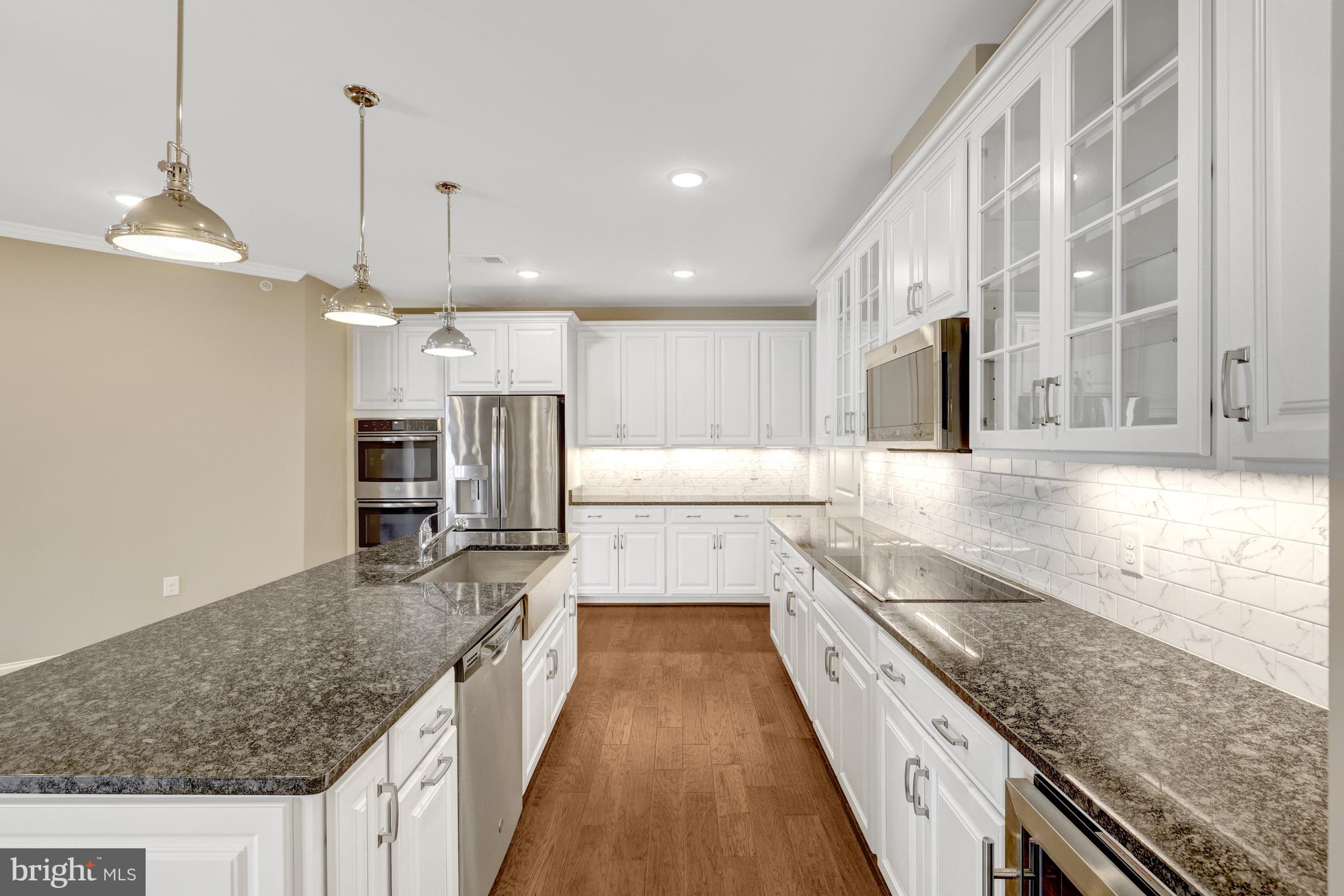 23631 Havelock Walk Terrace, Unit 404 Ashburn, VA 20148 - Photo 3 of 51 Abundance of Cabinetry and Countertops