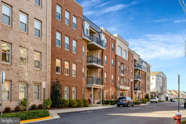 a city street lined with buildings and trees