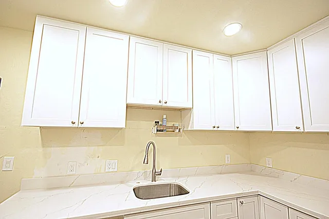 a kitchen with a sink and a window