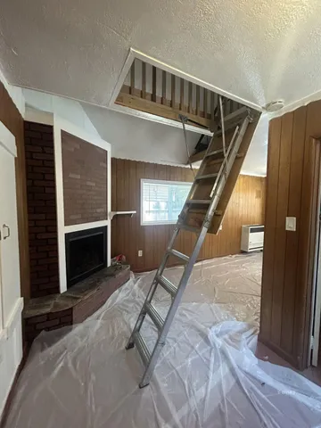 a view of staircase with wooden floor and stairs