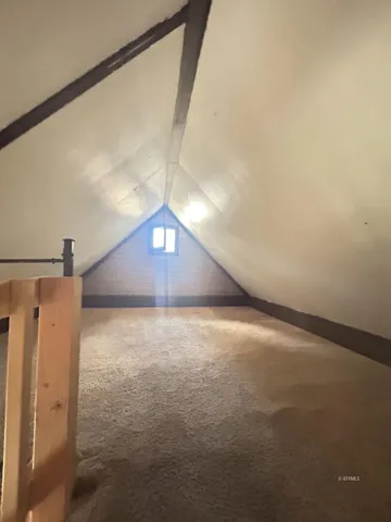 a view of a big room with a fireplace