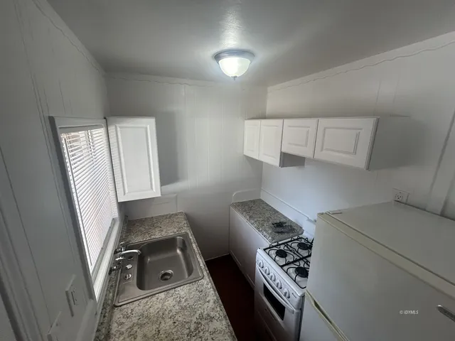 a view of kitchen and sink