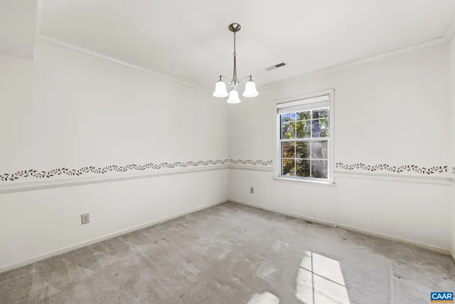 a view of hallway with wooden floor and stairs
