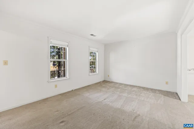 a bathroom with a granite countertop sink and a window