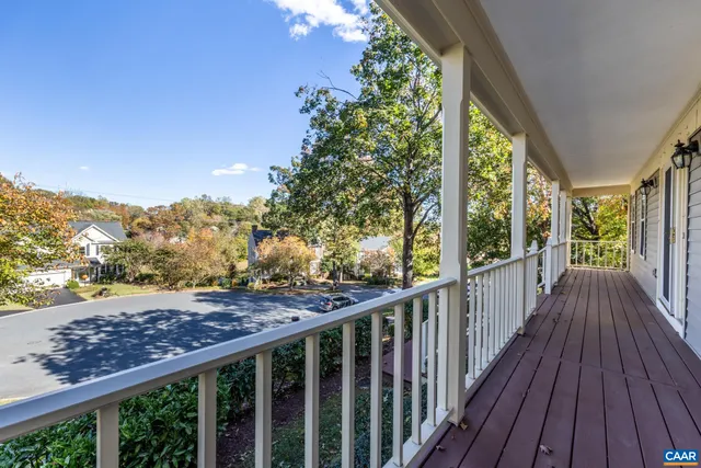 a view of a balcony with wooden floor