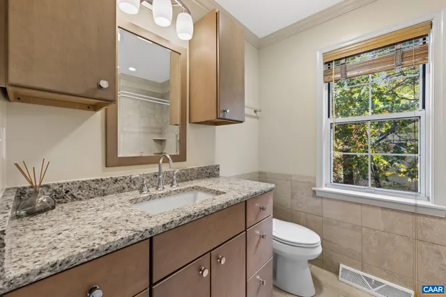 a view of backyard with seating area