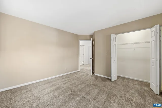 a view of balcony with wooden floor and fence