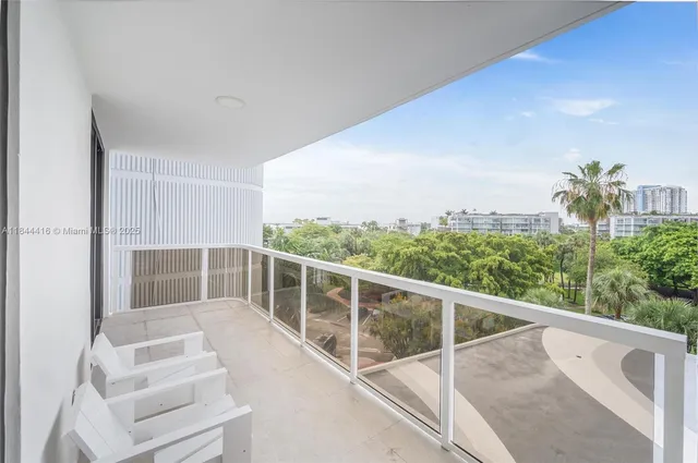 a view of balcony with furniture