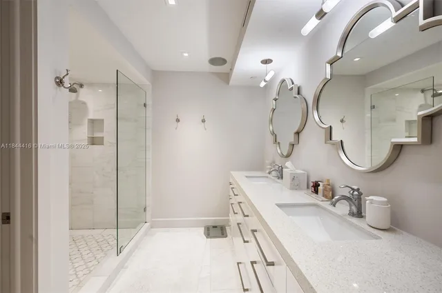 a bathroom with a double vanity sink mirror and double