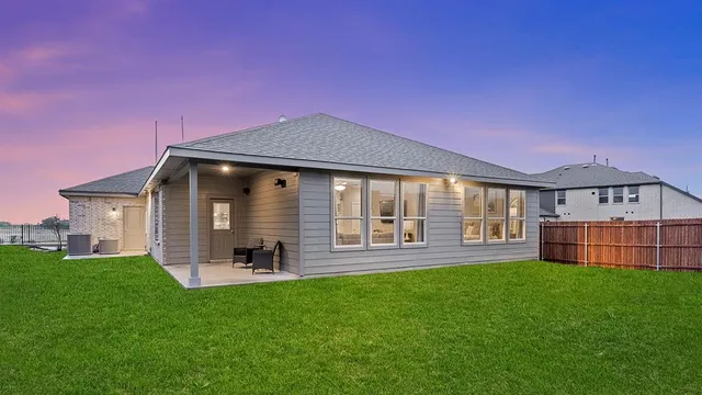 an aerial view of a house with outdoor space